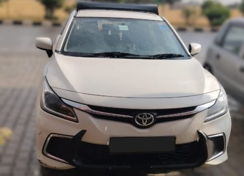 Toyota Glanza standing at roadside on the way to Manali